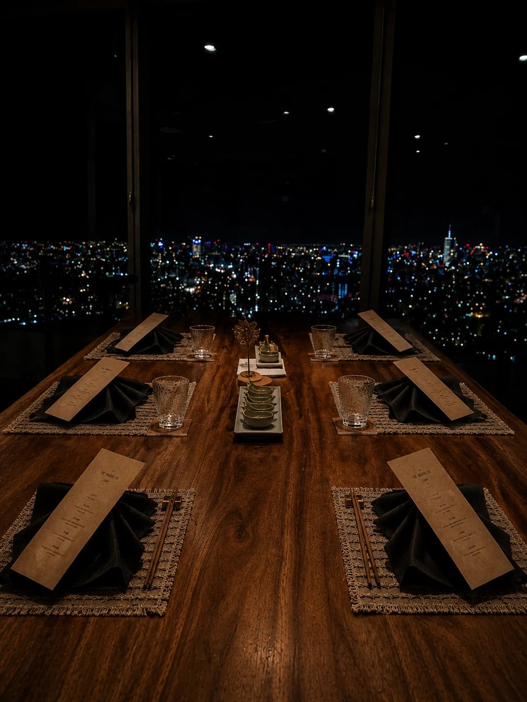 Nighttime private tasting table with Marbling menus and skyline lights